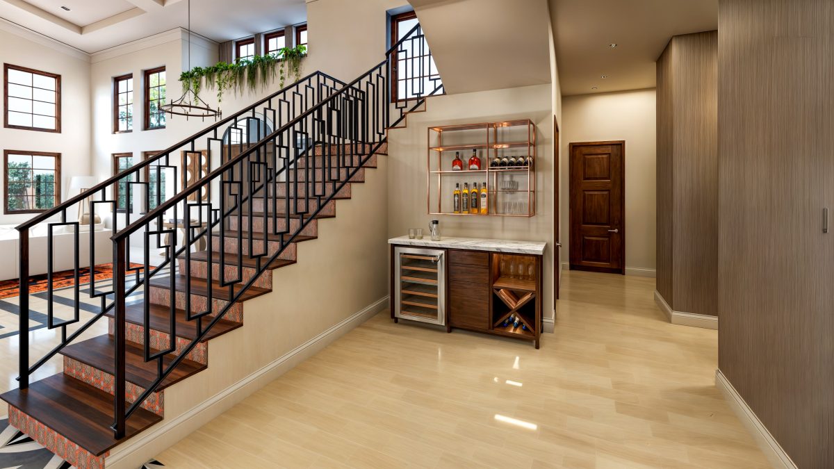 Entry hall with an open steel-and-timber stair and a built-in bar beneath it.