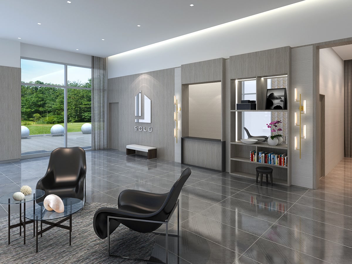 Lobby lounge with polished floors, dark seating and a full-height glazed wall.