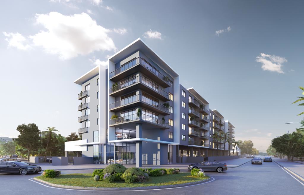 Corner view of the six-story apartment building with recessed balconies.